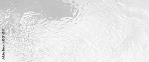 White water with ripples on the surface, defocus blurred white colored clear calm water surface texture, water panoramic banner background, white water texture, aqua surface with rings.