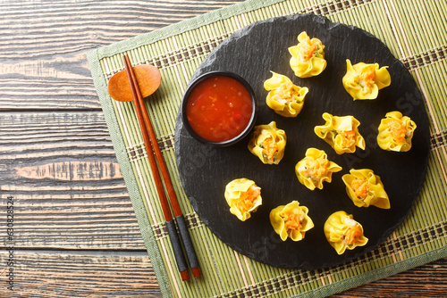Chinese Cantonese food shrimp dumpling Shumai closeup on the table. Horizontal top view from above