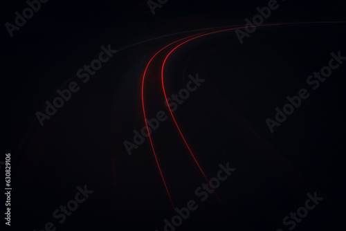 Light lines left by the car, the light of the car lights on the night highway