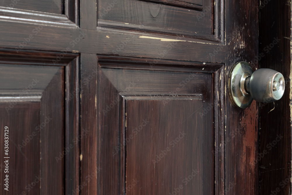 Old brown rough door. Wooden door with scratches Old brown rough door. Wooden door with scratches