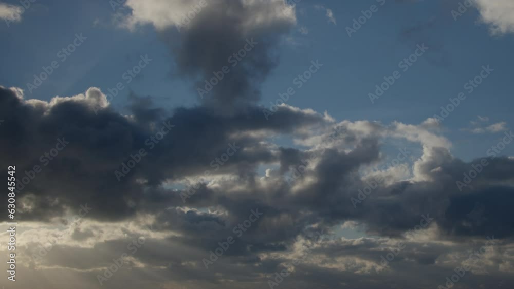 The blue morning sky is filled with swiftly moving cumulus clouds. The clouds serve as the background in this timelapse video. The blue morning sky is filled with swiftly moving cumulus clouds. The clouds serve as the background in this timelapse video.