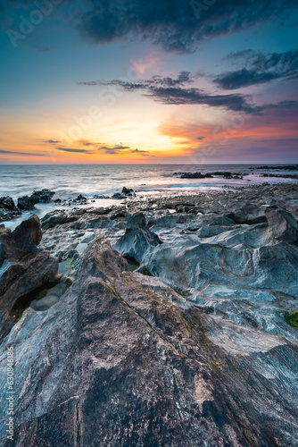 Sunset at the rocky beach at Vila Nova de Gaia, Portugal.