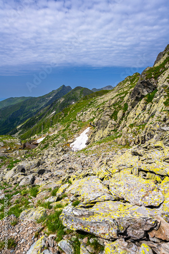 Summer landscape of the Fagaras Mountains. View from the hiking trail from Lake Balea to Mount Negoiu. Amazing rock formations of the Carpathians, Romania. © Szymon Bartosz