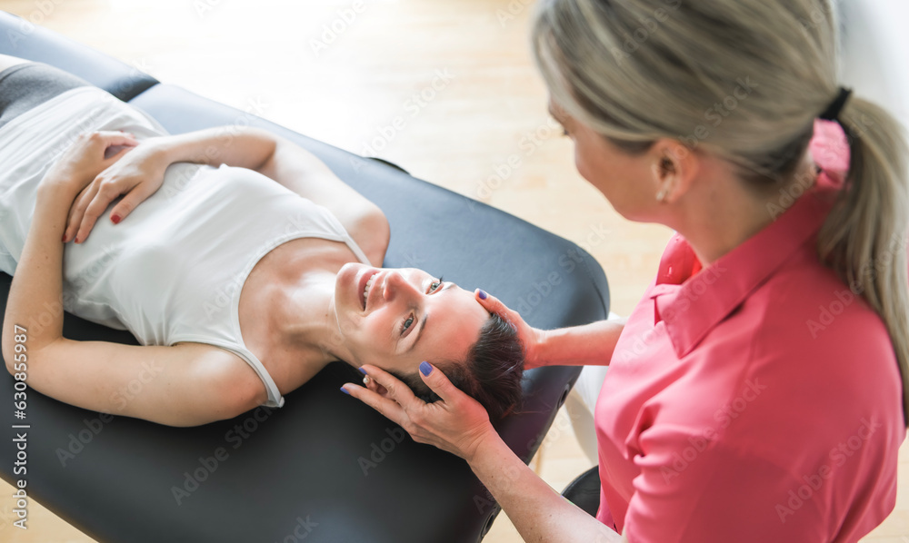 Fototapeta premium Modern rehabilitation physiotherapy clinic with professional and client