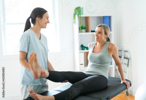 Modern rehabilitation physiotherapy clinic with professional and client
