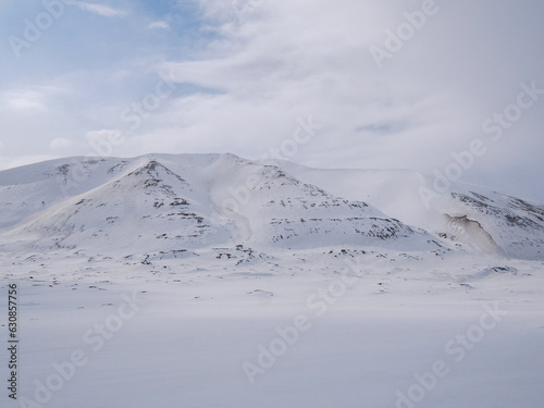 Arctic landscape of white snowy hills on Svalbard, Norway