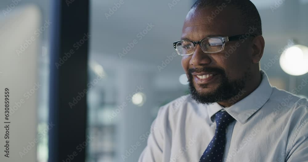 Computer, mature and a business black man at work in his office late at night on a management project. Face, glasses and a happy professional manager, CEO or boss working online for a company report