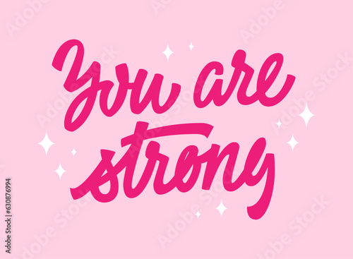 Inspirational  empowering trendy pink phrase lettering design - You are strong. Illustration of hand-drawn typography in modern script calligraphy style. Women support design element