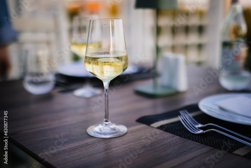 Wine glass on a table setting at restaurant