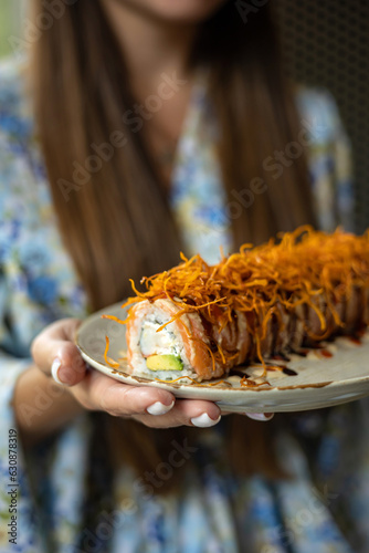 Delicious roll with salmon, Japanese cuisine. Black background. Close up 