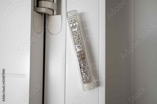 Mezuzah door jamb. Attaches to an external and internal  door jamb in a Jewish house. Mezuzah is a must-have item in a Jewish home. Hebrew letters shin and hai