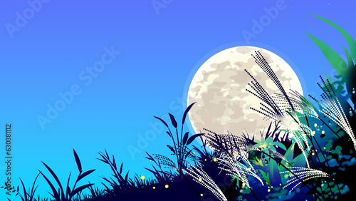 ススキのある秋の風景に十五夜の月
