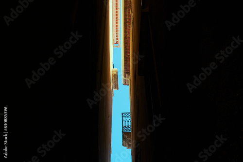 Fototapeta A narrow street of Alfama, Lisbon.