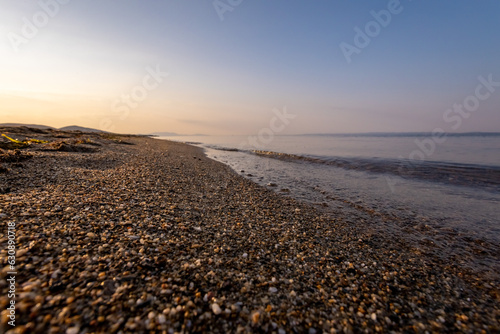 a sunset on the sea beach © vovan