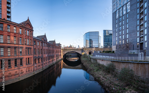 Historic inner city canal conservation area with an arche bridge  in Manchester, UK.