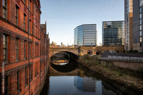 Historic inner city canal conservation area with an arche bridge  in Manchester, UK. photo