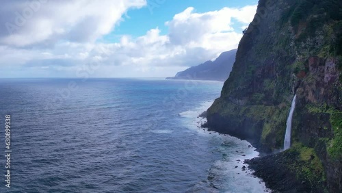 Veu da Noiva viewpoint with waterfall that flows directly into the Atlantic Ocean. Madeira island of Portugal photo