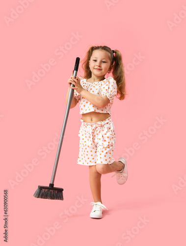 Cute little girl with broom...