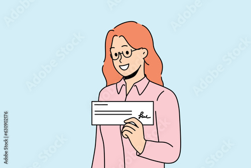 Woman with paycheck in hand smiles demonstrating financial document confirming receipt of salary or bonus. Signed paycheck in hands of businesswoman who closed deal and received payment from buyer