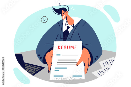 Man holds resume and sits at desk in recruiter office wanting to get solid job with high income