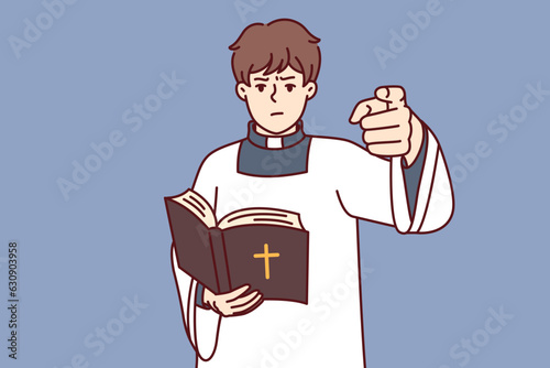 Catholic priest holding bible and reading sermons for guests of church, dressed in white priest robe. Catholic clergyman is dissatisfied with behavior of parishioners and exposes believers to anathema