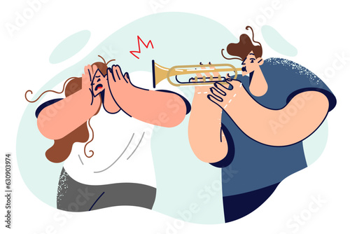 Man plays trombone, causing discomfort to woman covers ears and does not want to listen to music