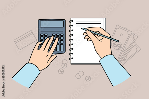 Hands of accountant using calculator for auditing and making entries in financial journal, located at table with money. Accounting services for preparation of financial analysis for business clients
