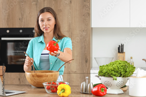 Young woman preparing veget...