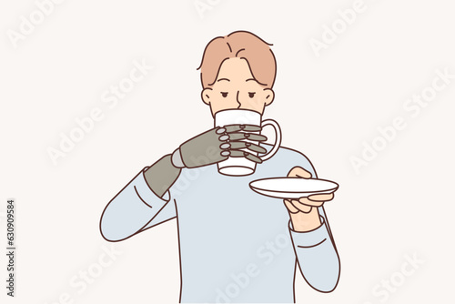 Man with bionic prosthetic arm drinks coffee from cup thanks to innovations in medicine
