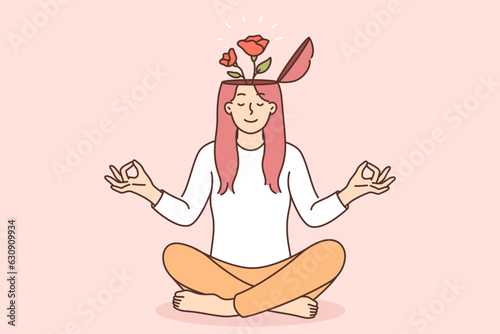Yogi woman meditates and feels how flowers grow from head, symbolizing mental harmony or balance