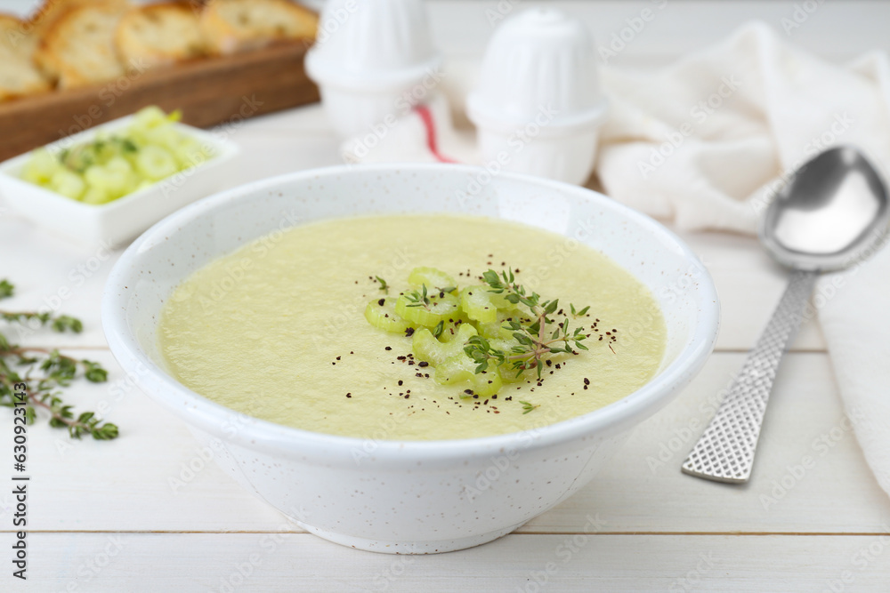 Bowl of delicious celery soup on white wooden table, closeup Bowl of delicious celery soup on white wooden table, closeup