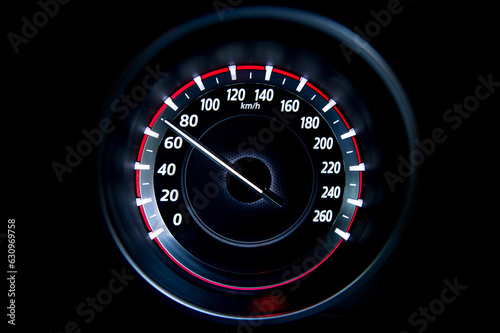 70 Kilometers per hour,light with car mileage with black background,number of speed,Odometer of car.