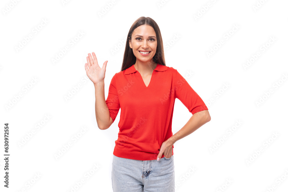 young smiling pretty caucasian brunette in a red short sleeve shirt on a white background with copy space young smiling pretty caucasian brunette in a red short sleeve shirt on a white background with copy space