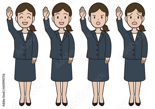 A young woman in a suit raising her hand