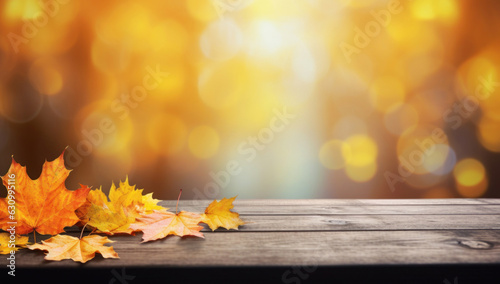 Autumn maple leaves on wooden table.