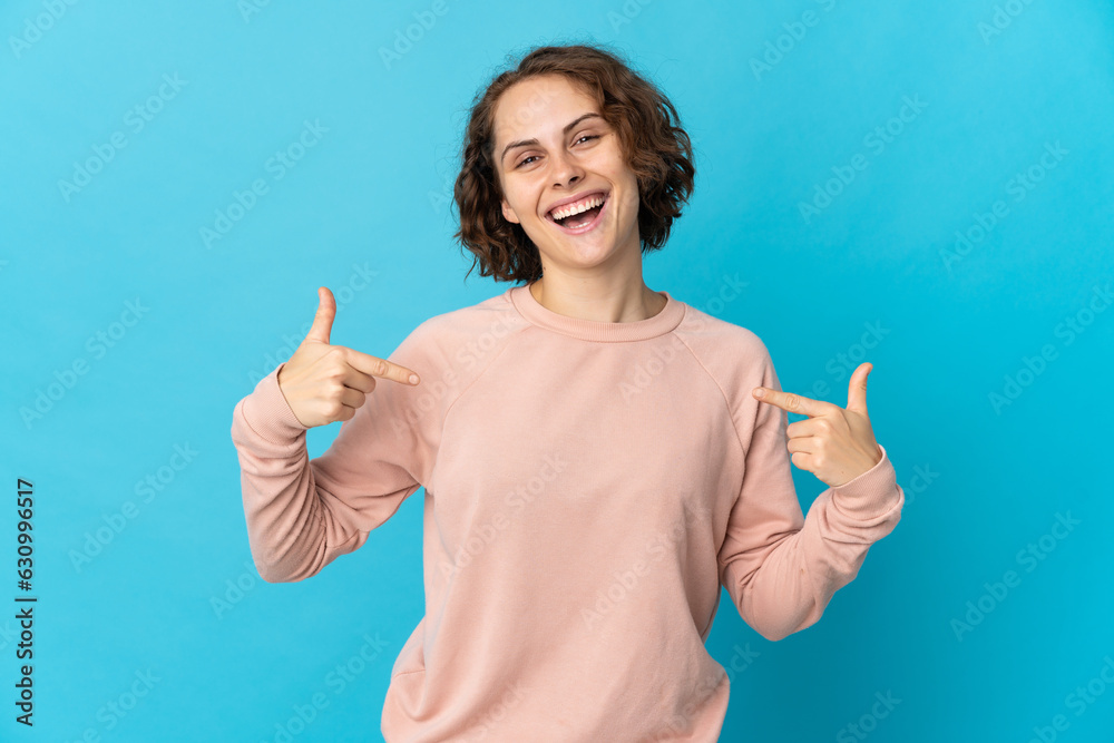 Young English woman isolated on blue background proud and self-satisfied Young English woman isolated on blue background proud and self-satisfied