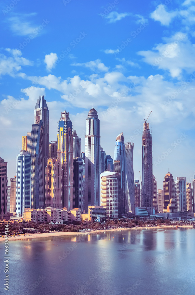 View of the skyscrapers of Dubai Marina from boats and yachts overlooking the waters of the Persian Gulf. Dubai, UAE.