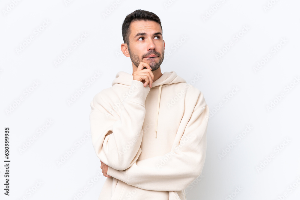 Young caucasian man isolated on white background having doubts and thinking Young caucasian man isolated on white background having doubts and thinking