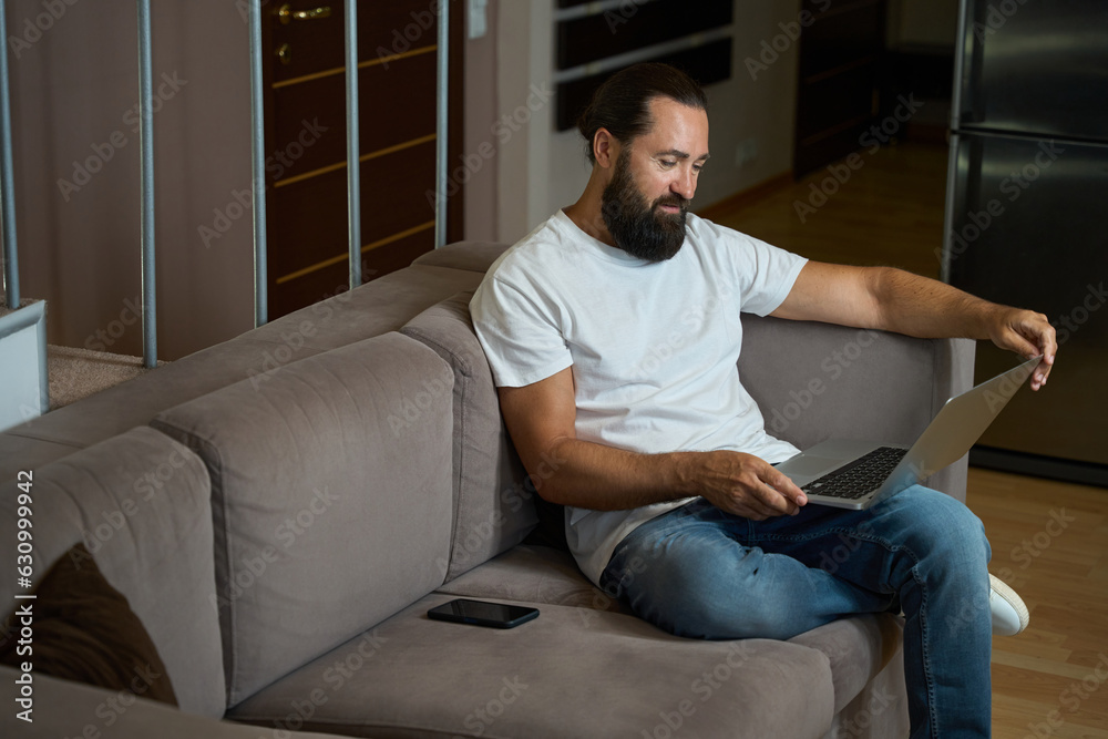 Hotel guest spends the evening in online communication Hotel guest spends the evening in online communication