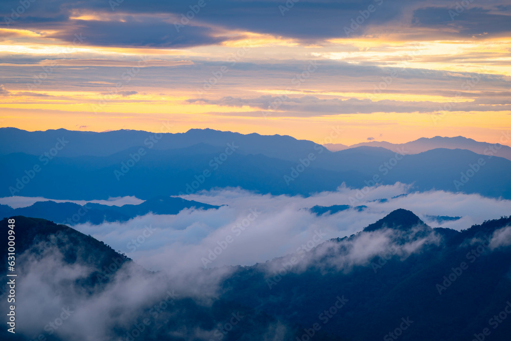 Mountain peak and sunrise covered by the sea of cloud in northern of thailand (Nan province, Thailand) เด่นช้างนอน