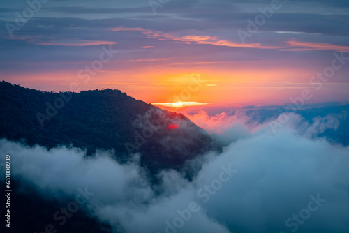 Mountain peak and sunrise covered by the sea of cloud in northern of thailand (Nan province, Thailand) เด่นช้างนอน