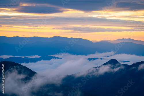 Mountain peak and sunrise covered by the sea of cloud in northern of thailand  Nan province  Thailand                                   
