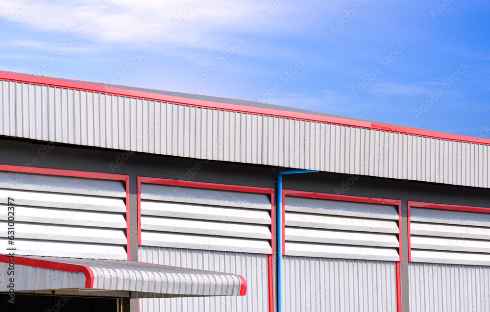 Aluminum Louvers and rain drain pipe on corrugated steel wall with roof ...