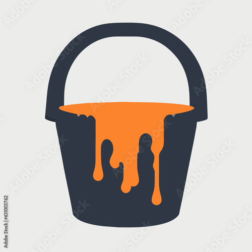 Halloween candy overflowing from a bucket
