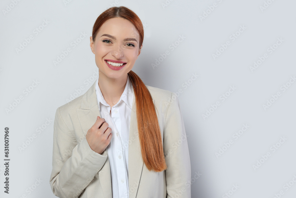 Portrait of beautiful young woman on light gray background, space for text Portrait of beautiful young woman on light gray background, space for text
