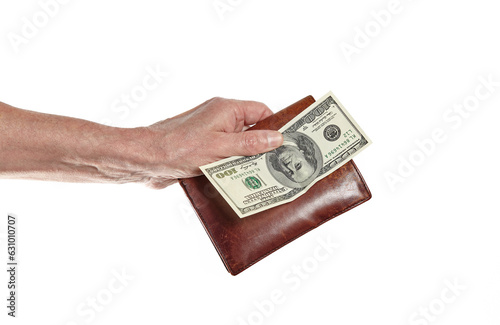 Men's hand holding leather wallet and dollar bill isolated on white background. Brown wallet with money in male hands