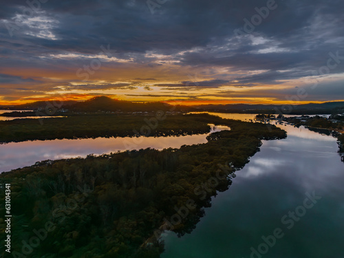 A moody winter sunrise waterscape with clouds