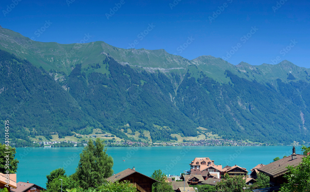 Iseltwald in Switzerland, fairytale small village and beautiful Bay on the southern shore of  the Lake Brienz in the Bernese Oberland with view on Emmental alps mountains with Brienzer Rothorn
