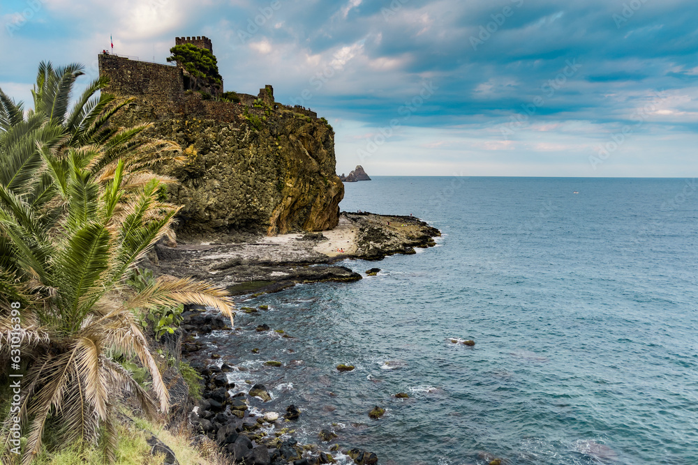 Norman Castle of Aci Castello under Cloudy Sky - A serene view of the castle, located in Catania province, set against a calm sea and a cloudy sky