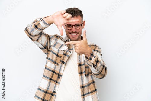 Young caucasian handsome man isolated on white background focusing face. Framing symbol © luismolinero